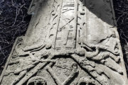 Gravestone with engraved skulls and crossbone from the Howff cemetery in Dundee, page of book Burial Grounds in Dundee by DD Tours
